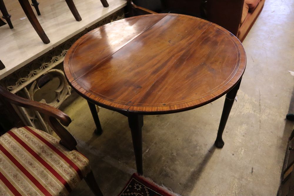 A George II satinwood banded mahogany pad foot drop leaf table, 90cm extended, width 94cm, height 70cm